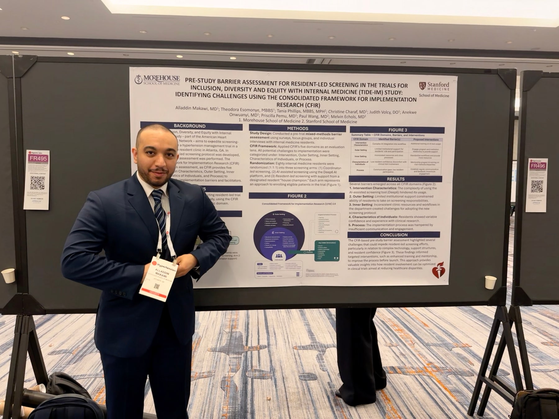 Alladdin Yousif Makawi, MD beside a hypertension research poster in Baltimore